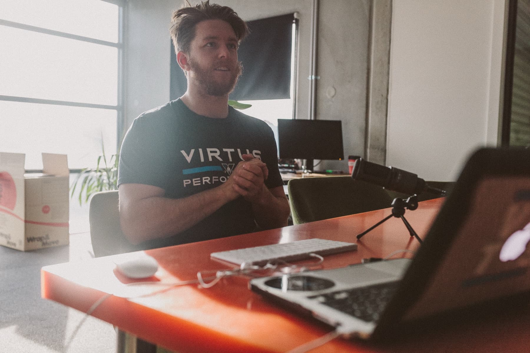 Lachie Wallace recording an early Virtus podcast at his desk