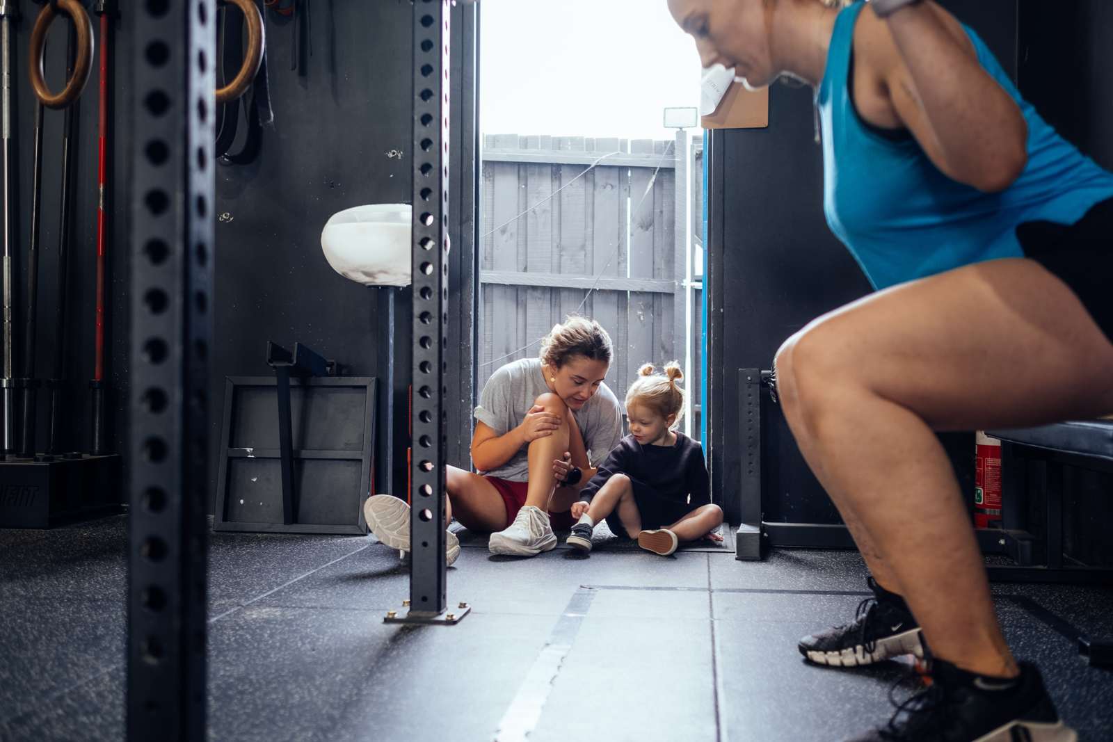 Heavy squats while the kids watch on